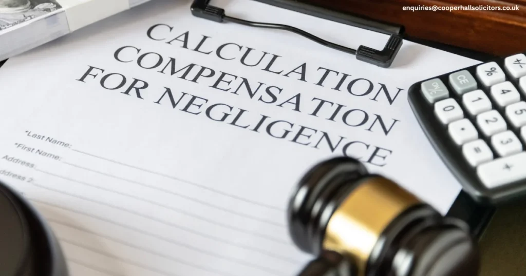 A Medical Negligence Compensation claim form sits next to a judge’s gavel and a calculator, clear signs of a legal case involving medical malpractice or clinical negligence. The scene points to the process of evaluating patient injury claims and determining what kind of compensation is owed.