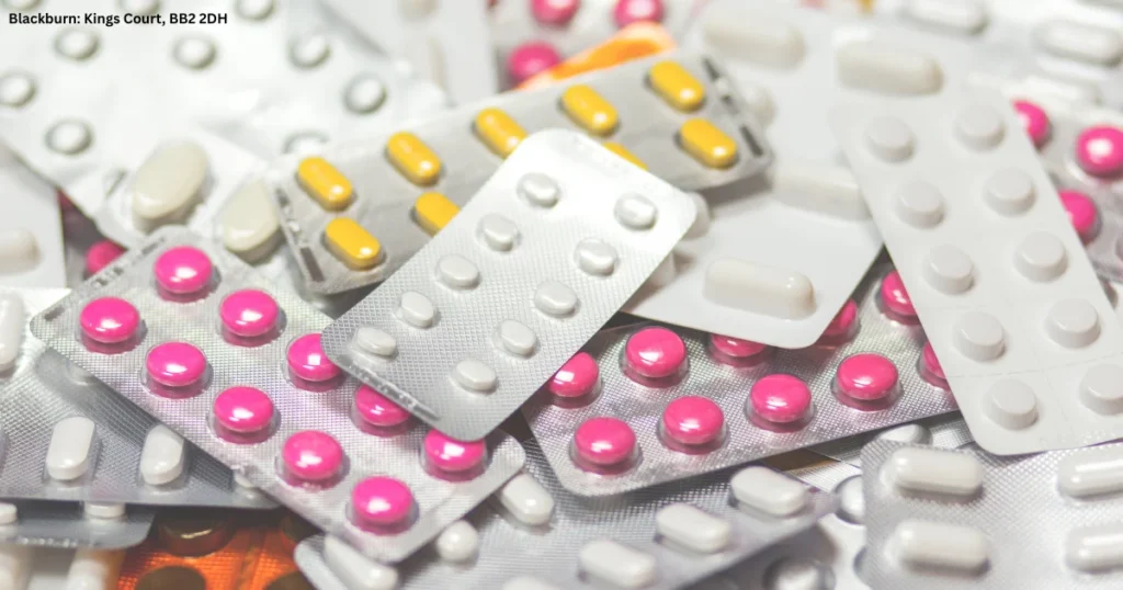 Close-up of a variety of blister packs with tablets and capsules illustrating the importance of medication safety and explaining what to do if the wrong medication is given to a patient after a prescription or dispensing error. 